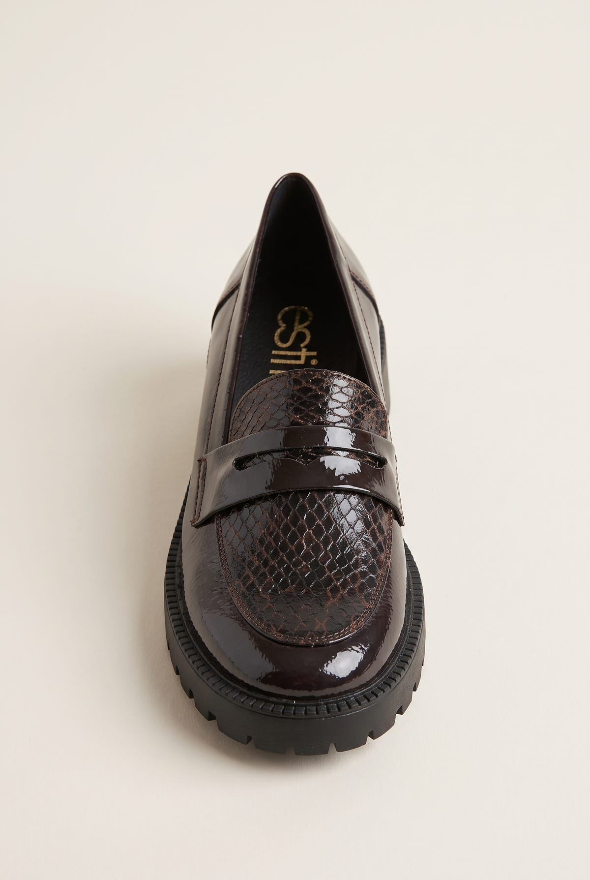Brown patent snake-embossed chunky loafer seen from the front three-quarter angle with penny strap