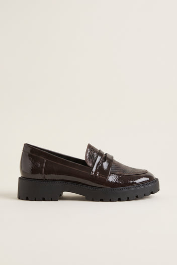 Brown patent chunky loafer with snake-embossed penny strap and dark lug sole, side view