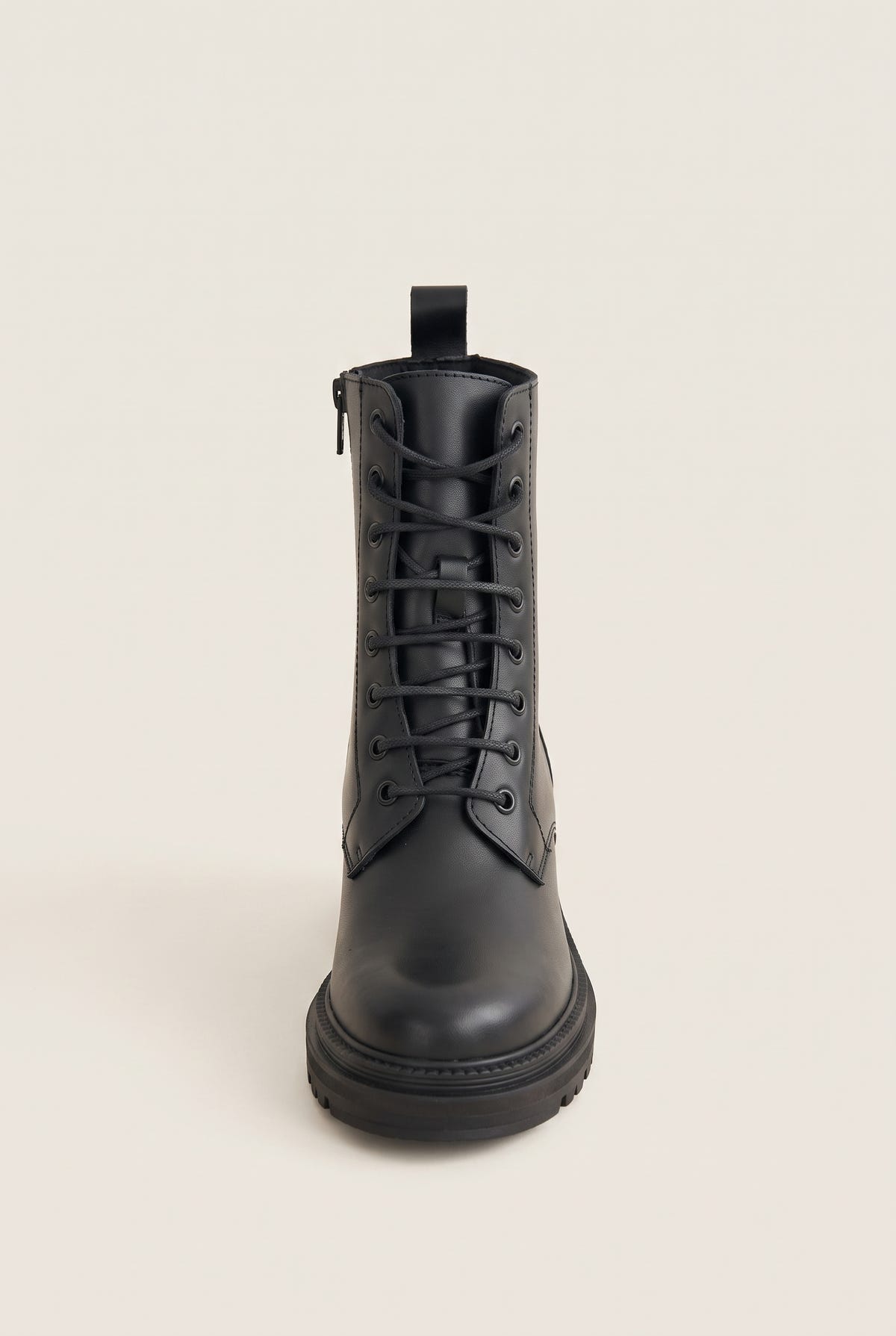 Front view of a black leather lace-up ankle boot with black laces, side zip, pull tab and a chunky lugged sole