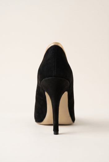Back view of a black suede pump with a slim stiletto heel and smooth black suede heel counter