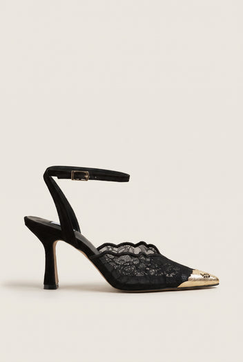 Side view of black lace detail stiletto pump with gold-toned pointed cap toe and ankle strap