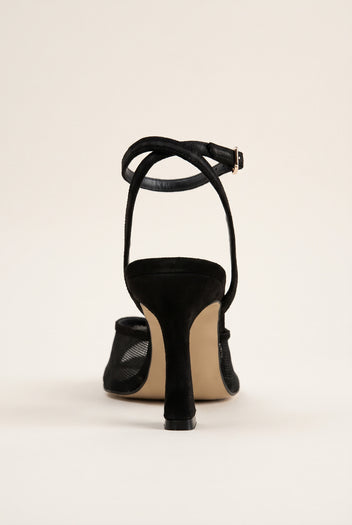 Back view of black lace stiletto slingback with ankle strap looping over a slim heel