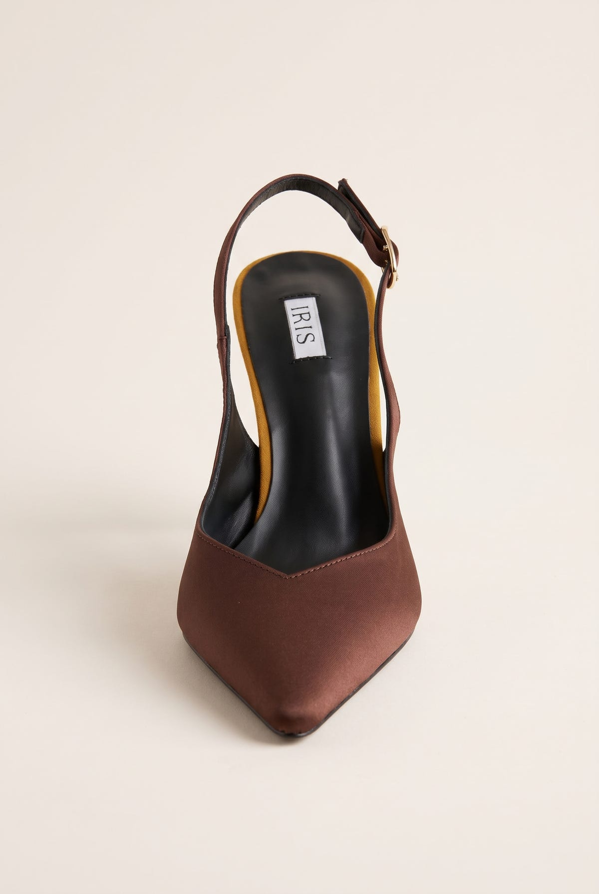 Front view of a brown satin slingback pump with a pointed toe and a dark insole visible through the open back