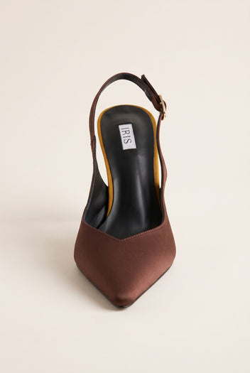 Front view of a brown satin slingback pump with a pointed toe and a dark insole visible through the open back
