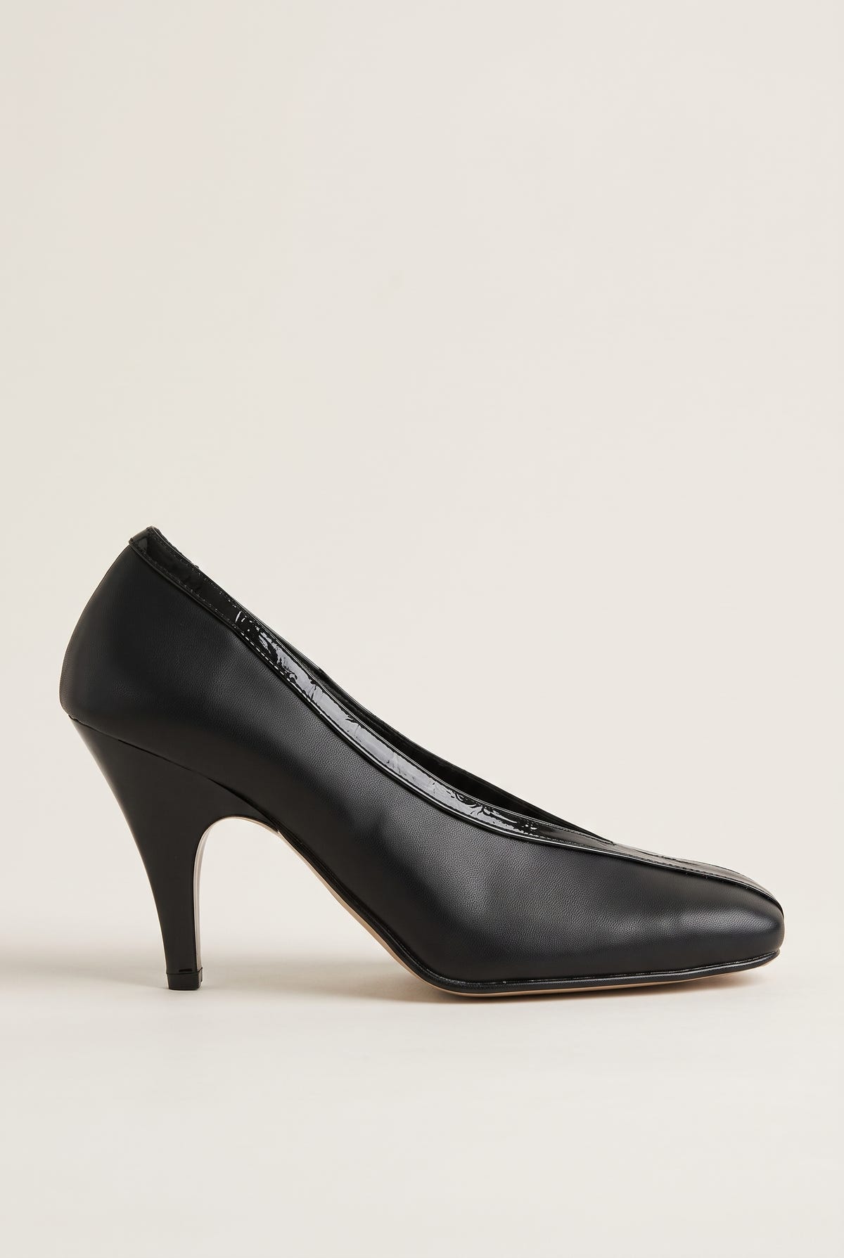 Side view of black leather-look court shoe with V-cut throat, glossy croc-effect trim and a curved high heel