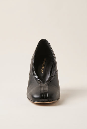 Front view of black court shoe with square toe, V-cut vamp and glossy croc-effect trim down the centre
