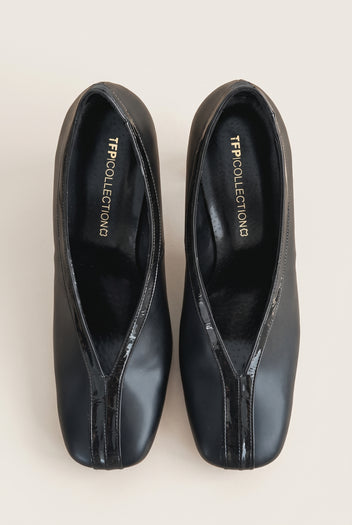 Top view of a pair of black court shoes with V-cut vamps, croc-effect trim and padded insoles