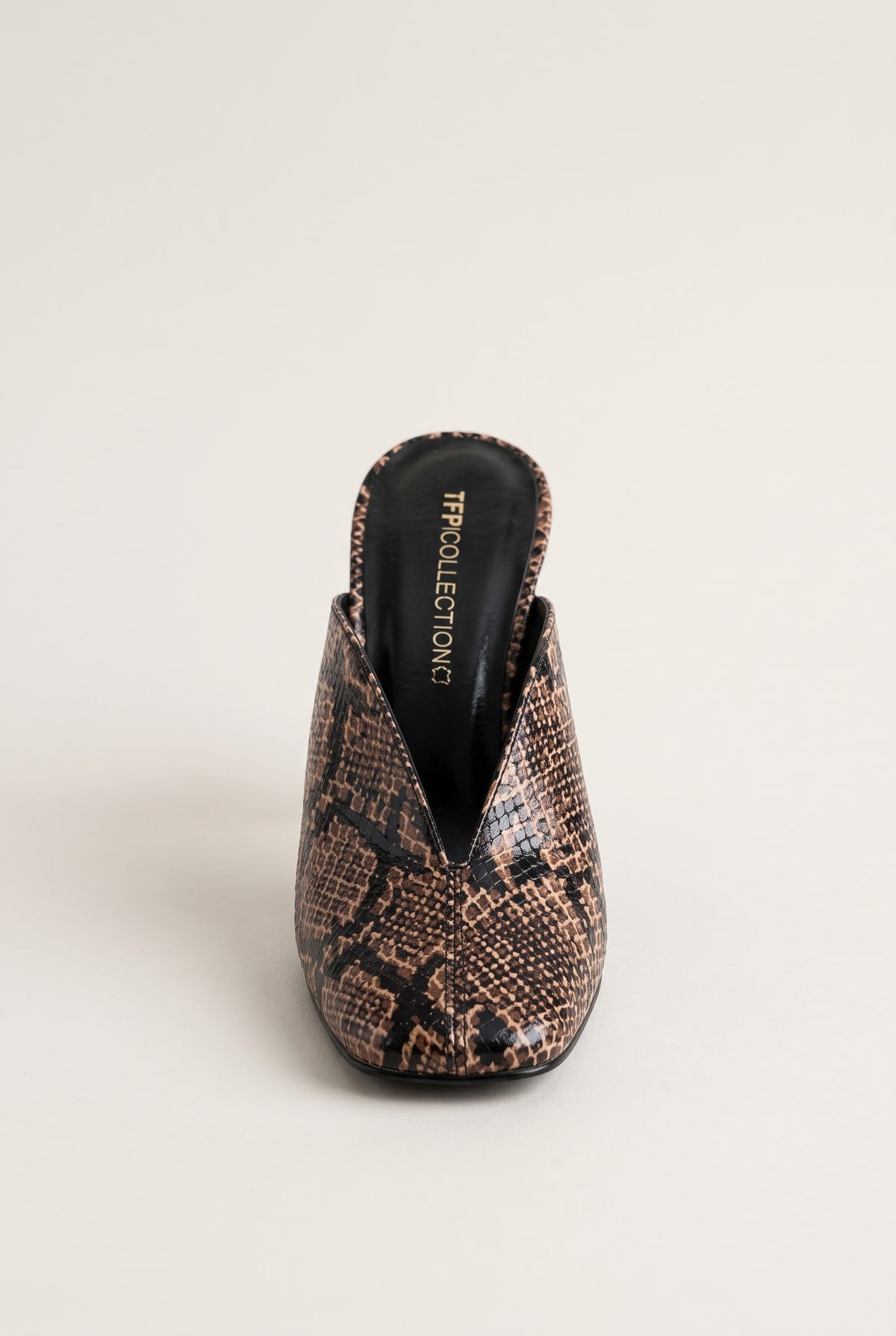 front view of one brown snake print mule with a square toe and black lining visible inside