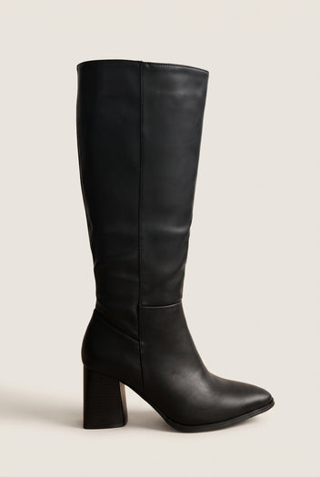 Side view of a black leather knee-high boot with pointed toe and stacked flared block heel on white