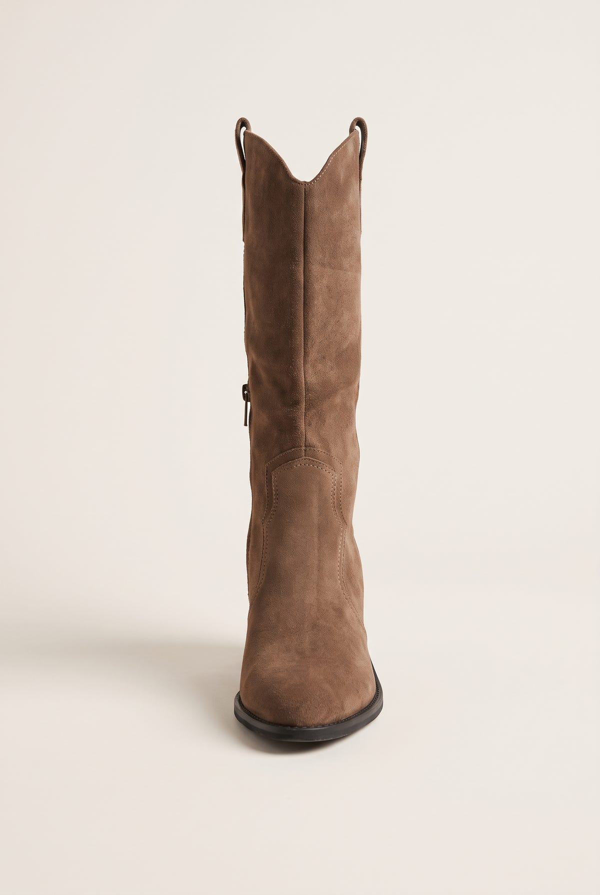 Front view of taupe suede cowboy boot with tall shaft, pointed toe and top pull tab
