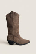 Taupe suede cowboy boot with pointed toe, block heel and top pull tab, side view
