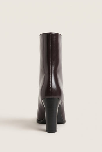 Rear view of brown leather ankle boot with straight shaft, narrow back seam and sturdy block heel