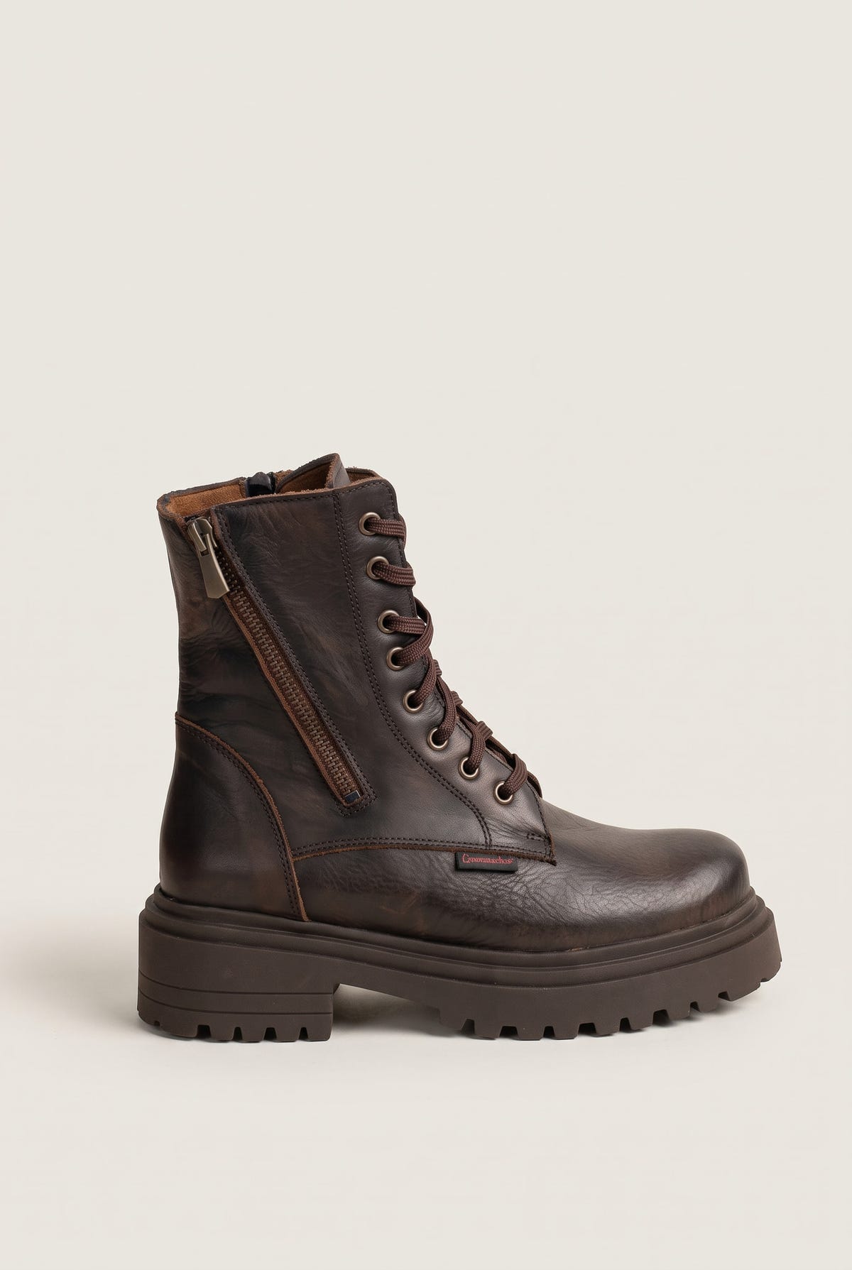 Side view of brown matte lace-up combat boot with side zipper and chunky lugged sole
