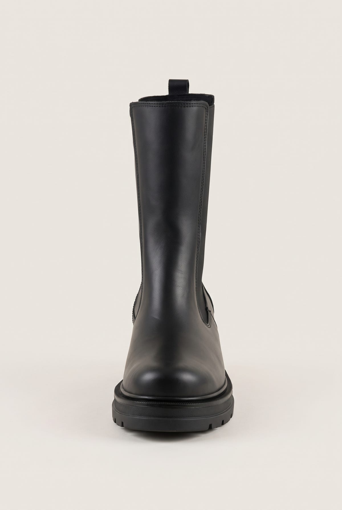 Front view of black matte chelsea boot with pull loop at the collar and low lugged sole