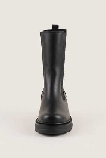 Front view of black matte chelsea boot with pull loop at the collar and low lugged sole