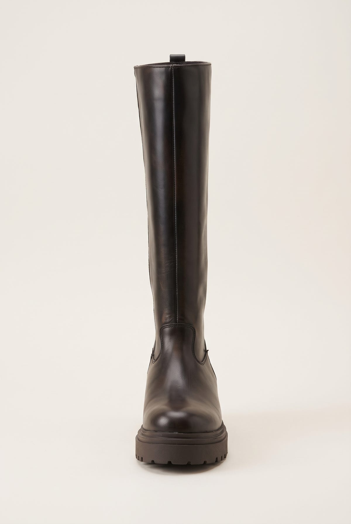 Front view of dark brown matte tall boot with narrow shaft and chunky lugged sole