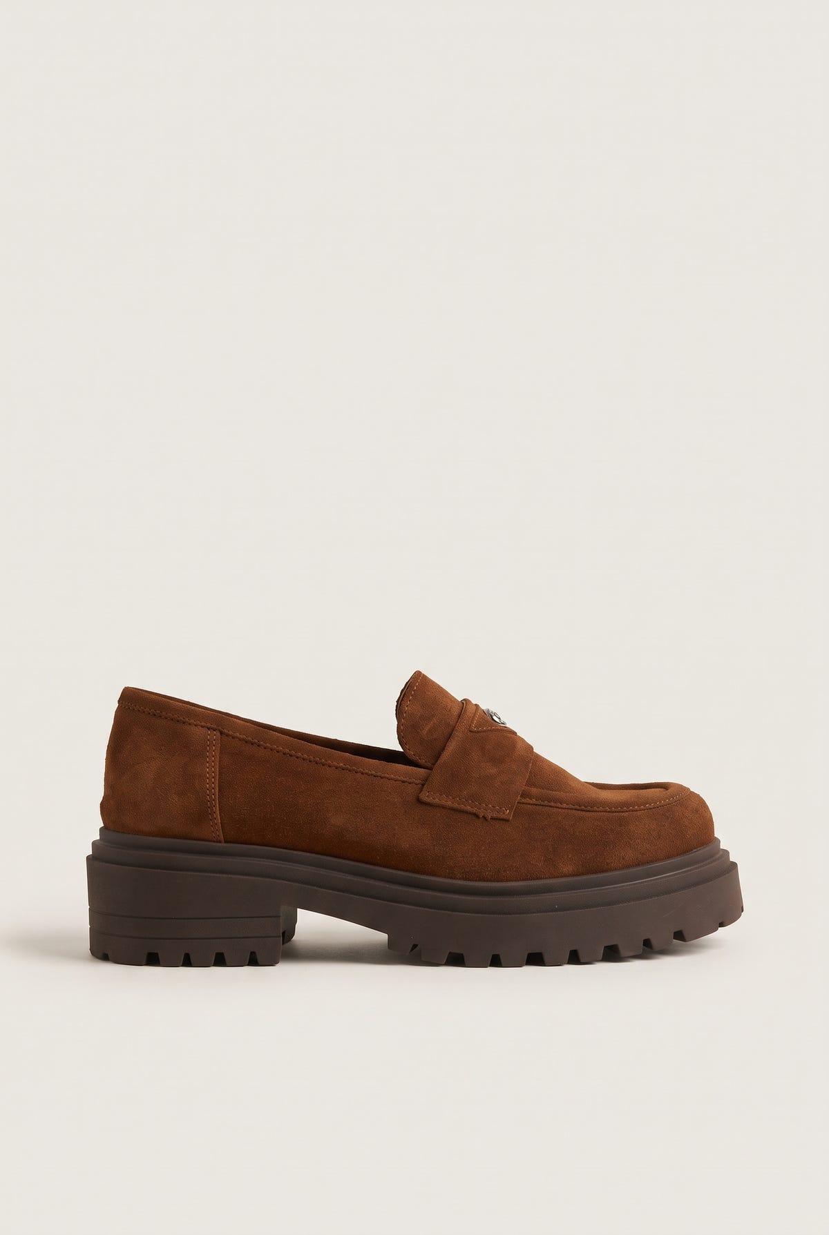 Side view of tan suede stitch detail loafer with chunky lugged sole and penny strap