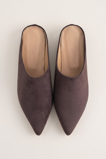 Top view of brown suede pointed toe mules with tan leather insoles and open backs