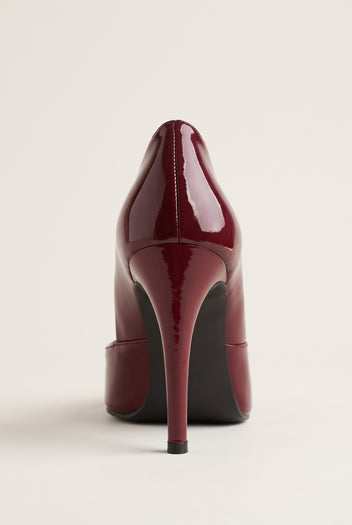 Back view of a bordeaux red patent pump showing the high stiletto heel and smooth curved heel counter