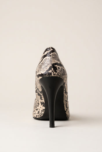 Back view of an ivory and black snake-print pump with a tall slim black heel and curved heel counter