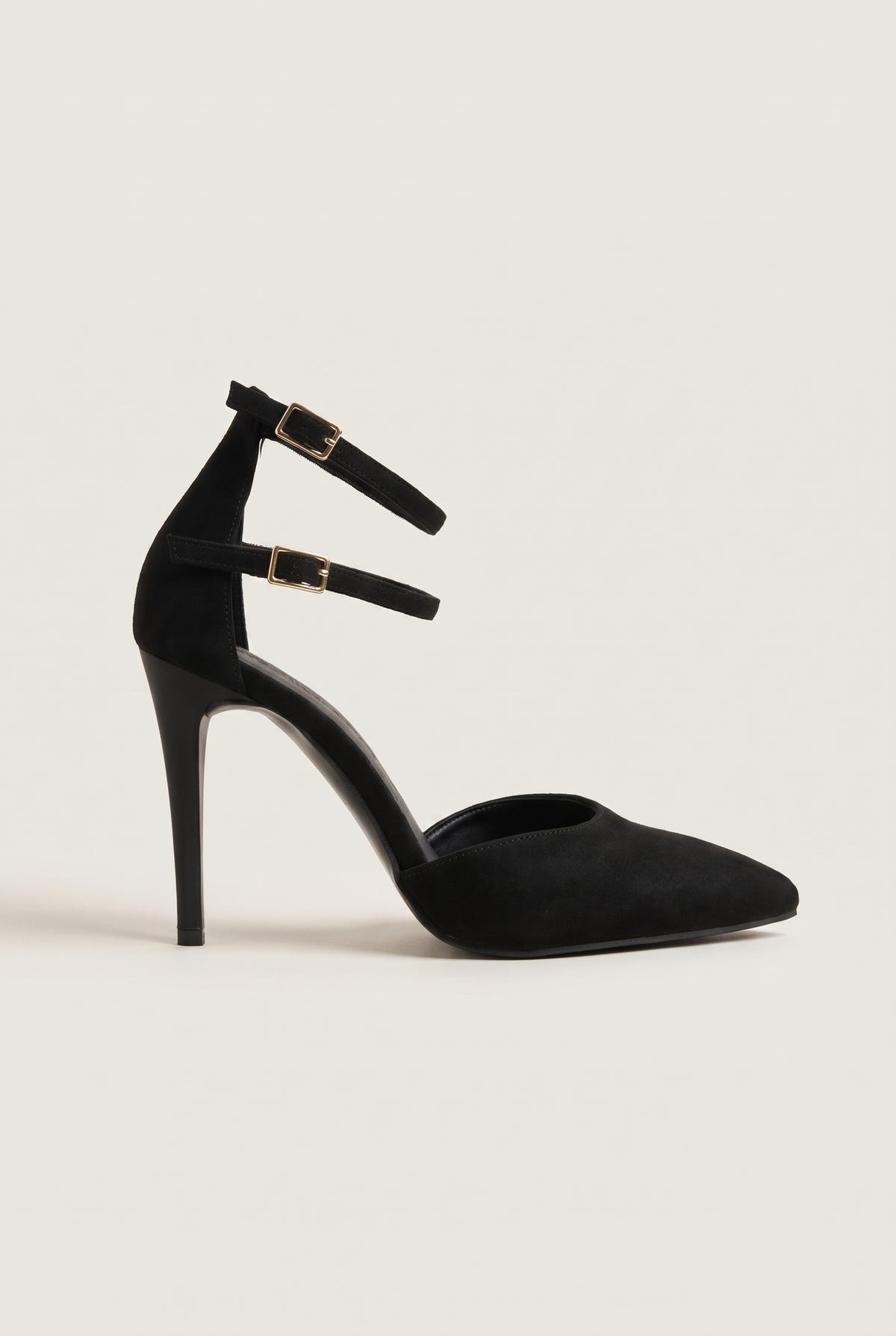 Single black suede pointed toe pump with double ankle straps and gold buckles, side view showing the stiletto heel