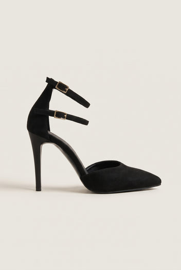 Single black suede pointed toe pump with double ankle straps and gold buckles, side view showing the stiletto heel