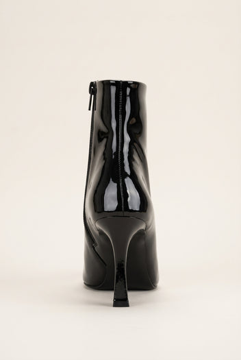 Back view of black patent ankle boot showing the rear zip and tall stiletto heel