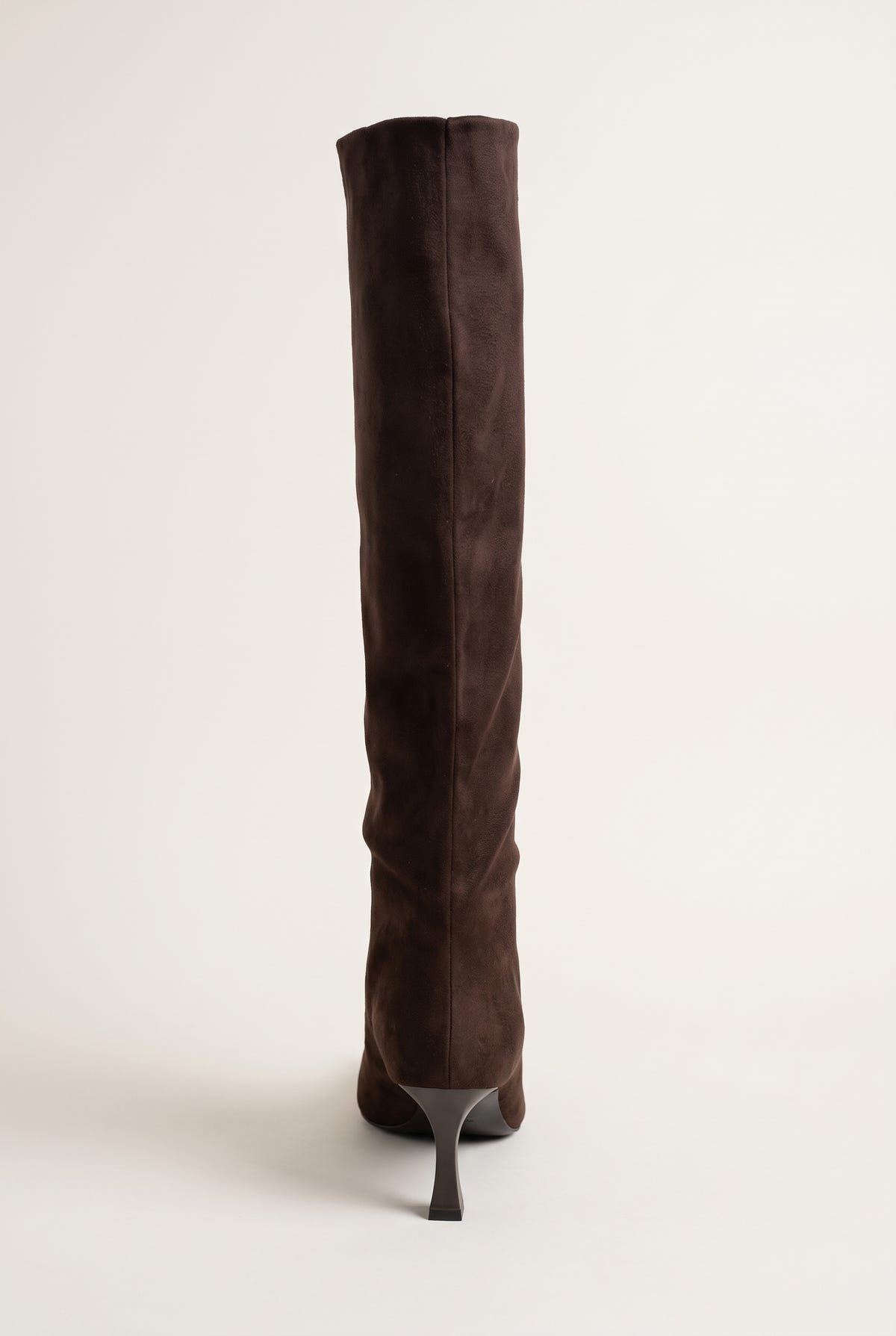 Brown suede stiletto boot in rear three-quarter view showing the tall slim shaft and thin heel