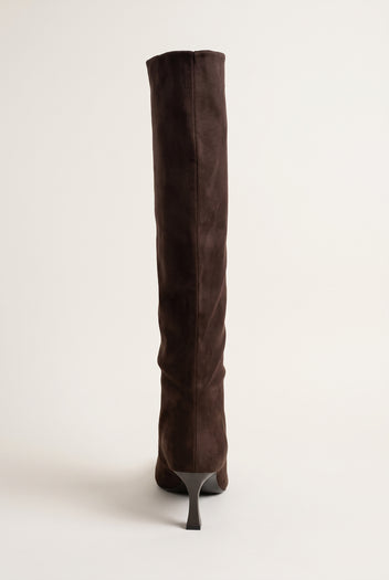 Brown suede stiletto boot in rear three-quarter view showing the tall slim shaft and thin heel