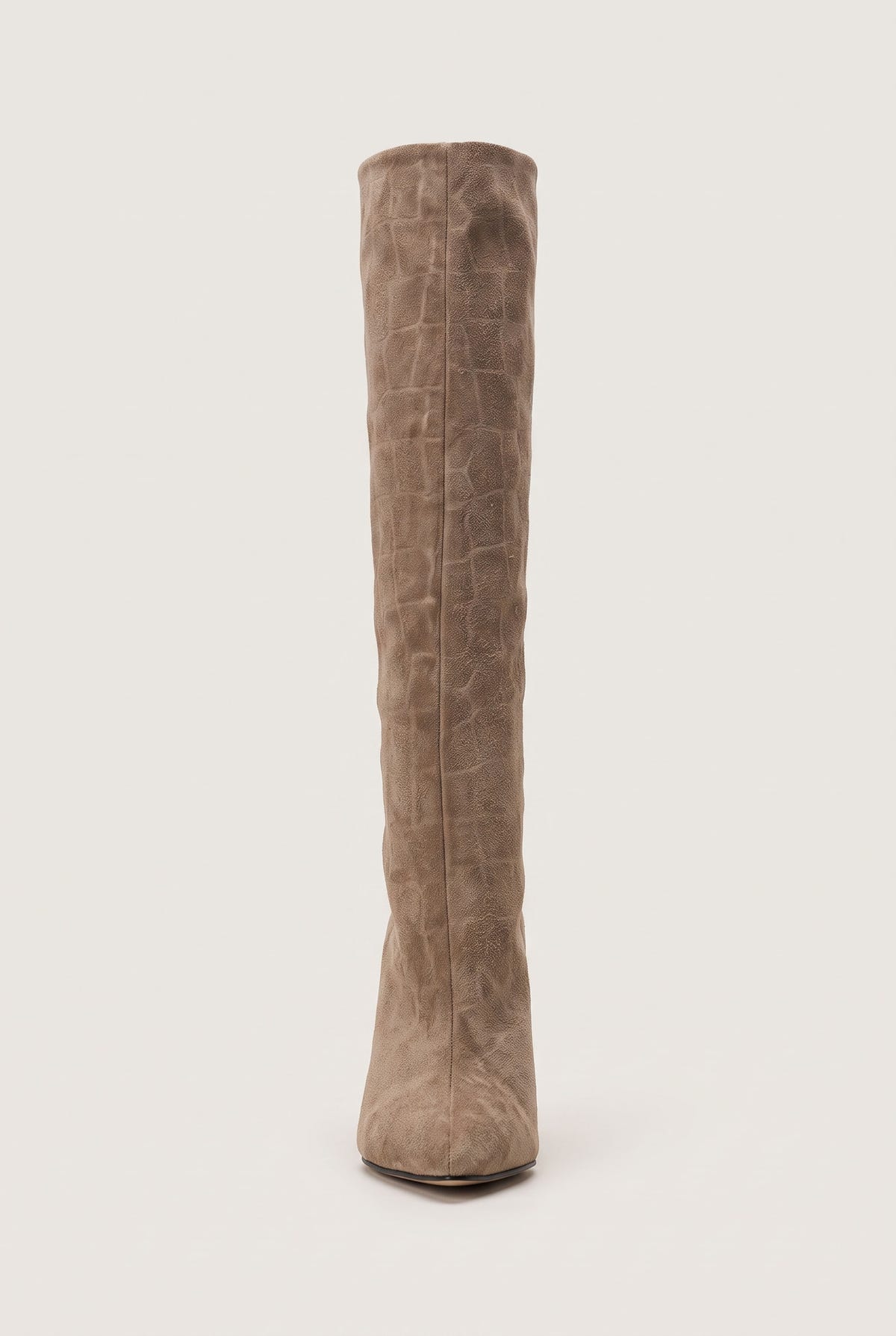 Front view of a tall beige croc-embossed suede boot with a narrow shaft and a pointed toe