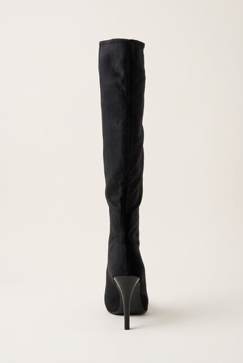 Back view of black velvet knee high boot showing the tall shaft and slim stiletto heel