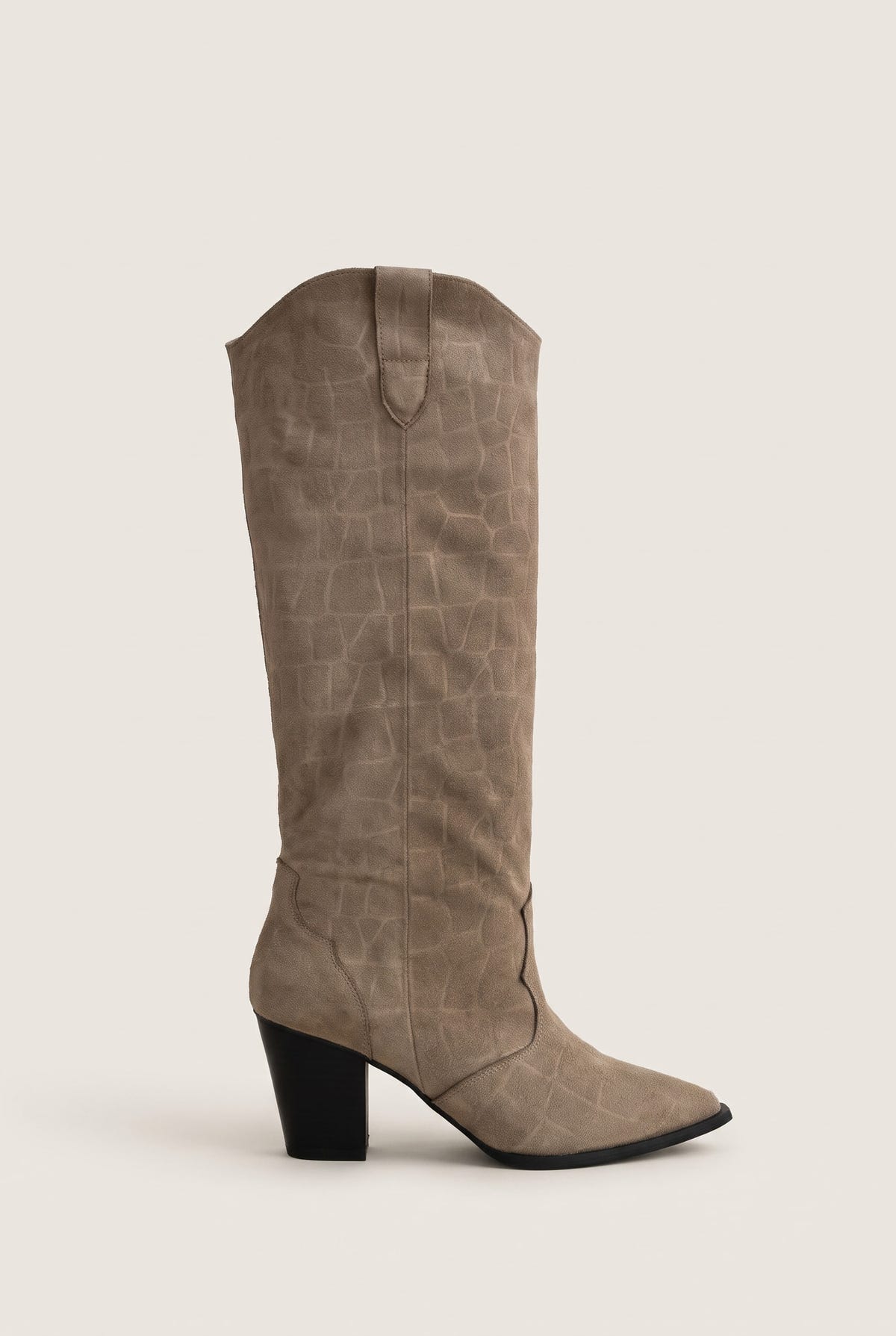 Beige croc embossed suede knee high cowboy boot with pointed toe and stacked block heel in side view