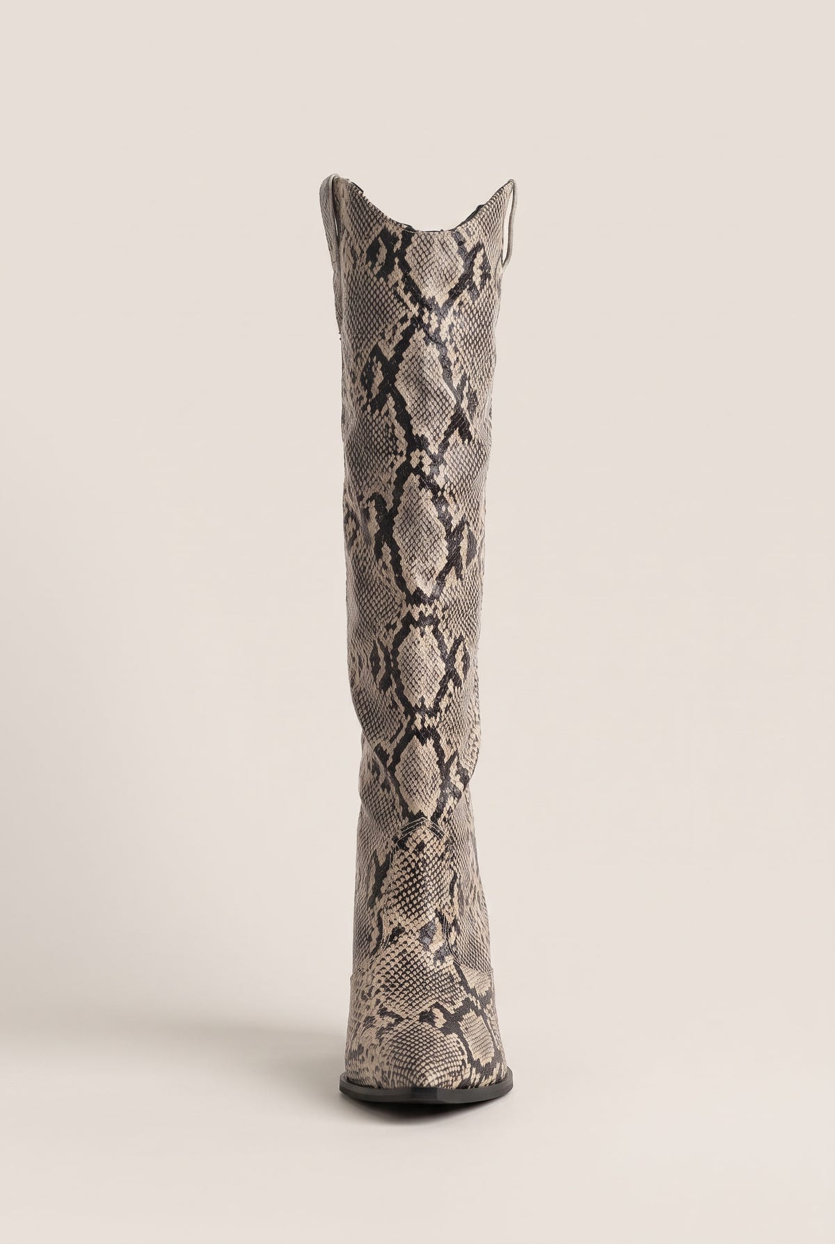 Tall ivory and black snake print cowboy boot in front view with notched V top and slim straight shaft
