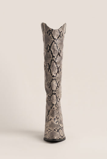 Tall ivory and black snake print cowboy boot in front view with notched V top and slim straight shaft