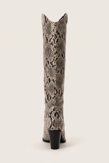 Rear view of ivory and black snake print cowboy boot showing the stacked heel and notched top edge