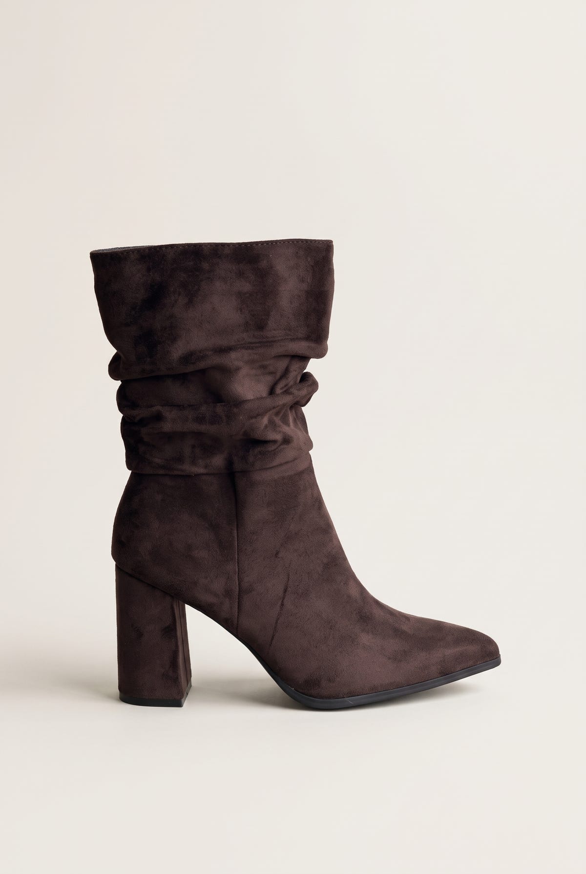 Single dark brown suede ruched ankle boot with a block heel and pointed toe, side view of the gathered shaft