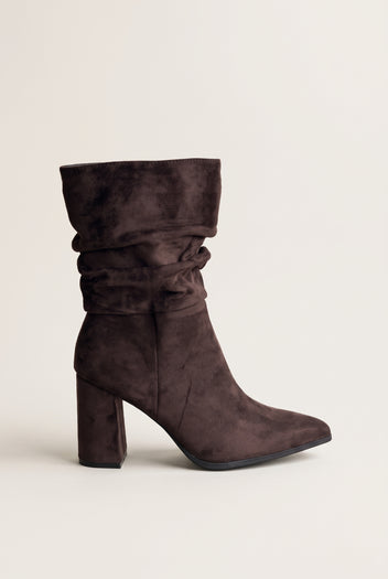 Single dark brown suede ruched ankle boot with a block heel and pointed toe, side view of the gathered shaft