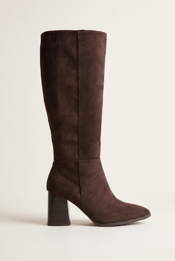 Single dark brown suede knee-high boot with a pointed toe and chunky block heel, side view on a light surface
