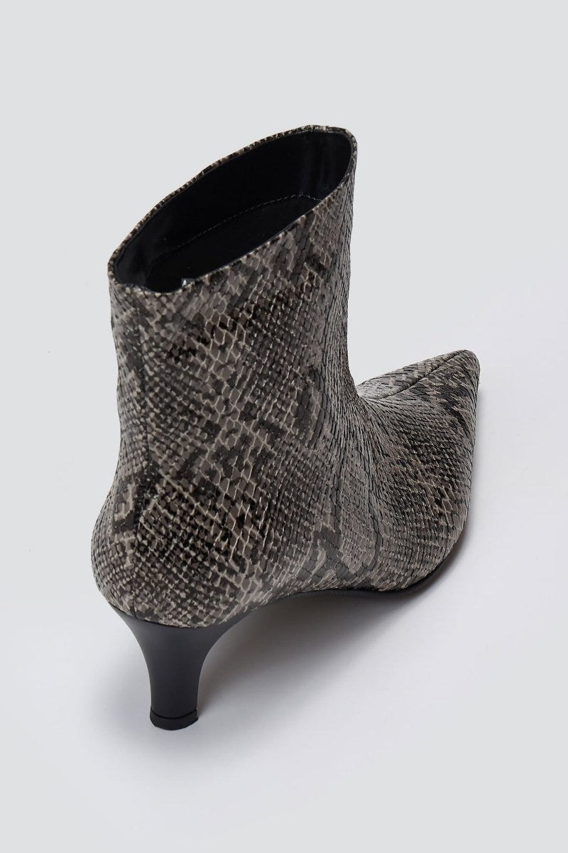 Grey snake-embossed leather ankle boot with pointed toe and kitten heel, angled view on a light grey background