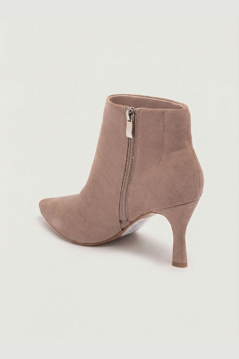 Taupe suede pointed-toe ankle boot with stiletto heel and side zip, side view on a light grey background