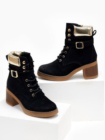 Black lace-up block heel ankle boots with gold padded collar, buckle strap and gum sole, front view on white blocks
