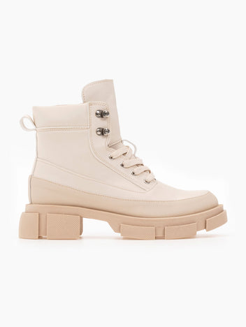 Beige faux leather lace-up ankle boot with metal D-ring eyelets, stitched panels, pull tab and chunky lugged sole, side view on white