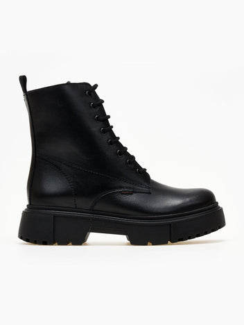 Black leather lace-up ankle boot with lug sole and cap toe, side view on a light background