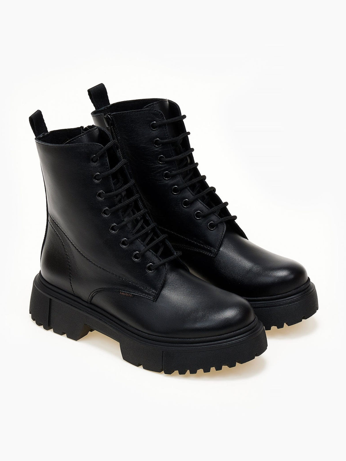 Black leather lace-up ankle boots with cap toe and lug sole, pair in angled view on a light background