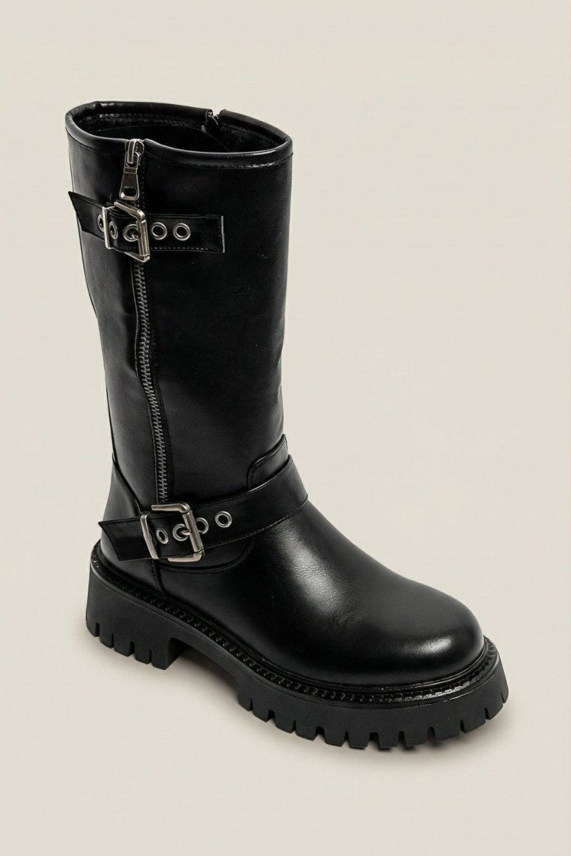 Black leather knee-high boot with buckle straps and chunky sole, angled view on light grey background