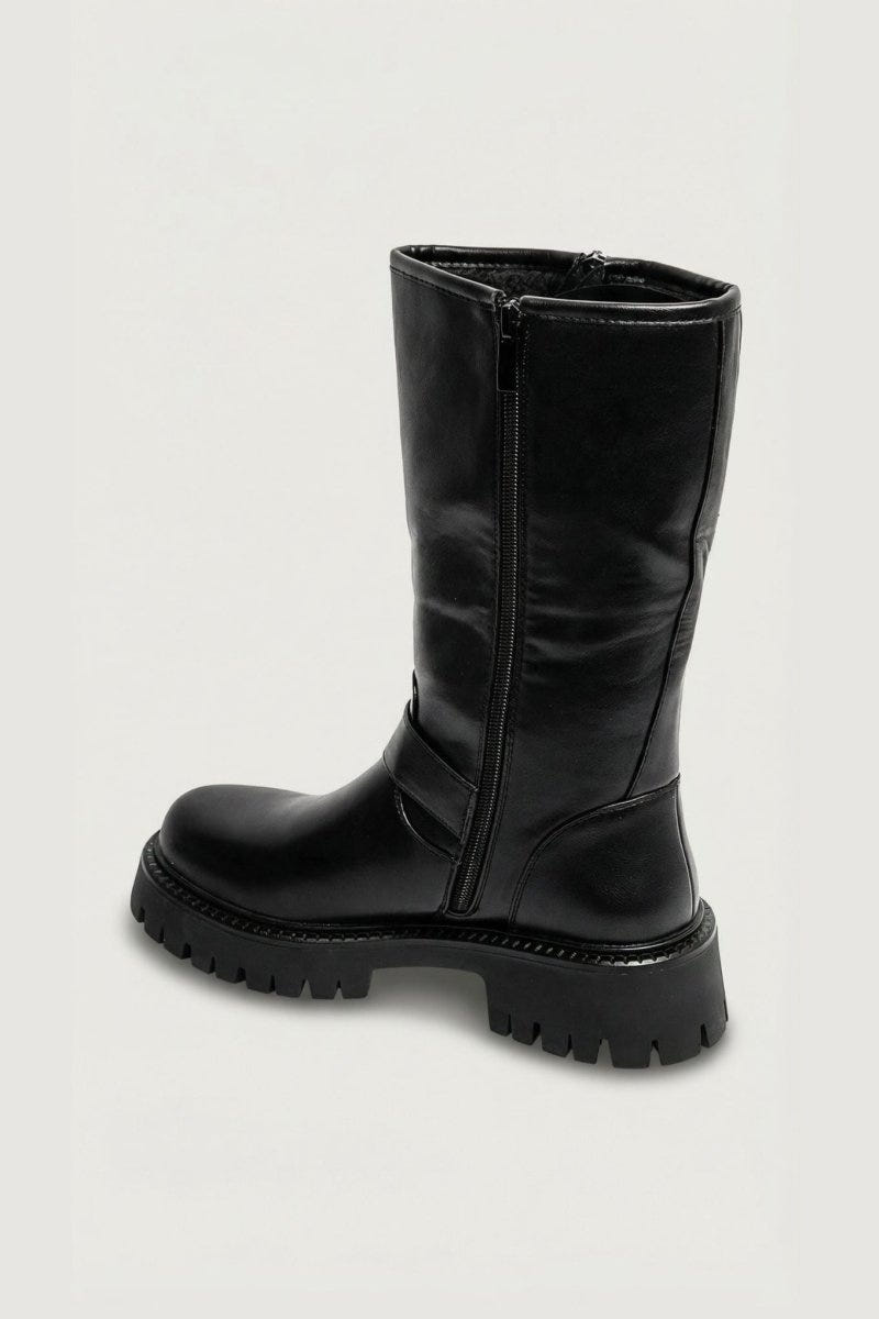 Black leather knee-high boot with side zip and chunky sole, side view on light grey background