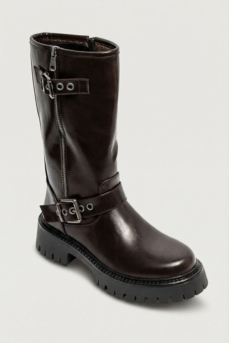 Brown glossy leather knee-high boot with buckle straps and side zip, angled view on light grey background