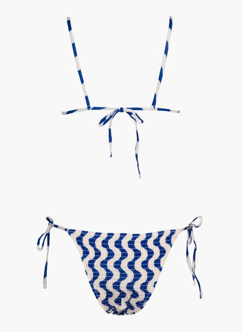 Blue and white zigzag print string bikini top with tie back and matching side-tie bikini bottom, laid flat