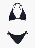 Black triangle halter bikini top and black side-tie bikini bottom, laid flat on white background