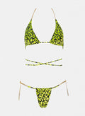 Yellow and black leopard print triangle bikini top with wrap straps and matching string bikini bottom, laid flat on white